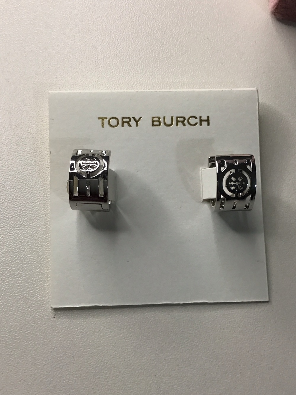 Tory Burch Silver Tone Logo Huggie Earrings